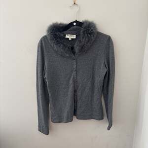 GREY Heidi Weisel cardigan with a faux fur collar.